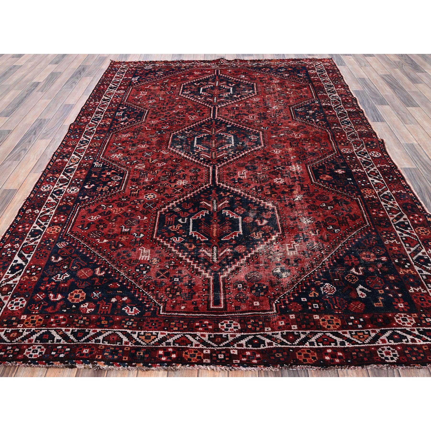 6'4"x9' Carmine Red, Vintage Persian Shiraz with Geometric Medallion, Small Animal Figurines, Worn and Distressed, Shaved Low, Zero Pile, Sides and Ends Professionally Secured, Hand Knotted, 100% Wool, Oriental Rug Sh1017