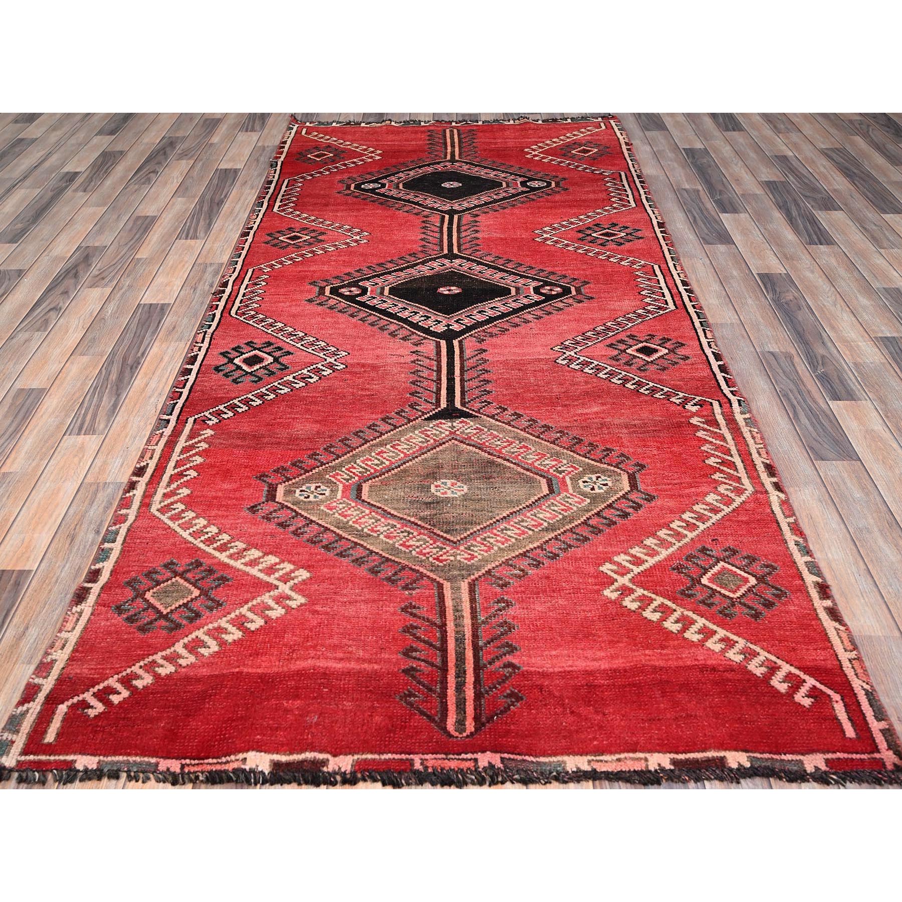 4'3"x9'3" Rusty Red, Semi Antique Shiraz with Geometric Medallion, Evenly Worn, Full Pile, Organic Wool, Sides And Ends Professionally Secured and Cleaned, Sheared Low, Hand Knotted, Distressed, Wide Runner Oriental Rug Sh86680